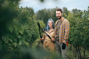 Gardening basics: A Woman Holding Shears while Standing beside a Man