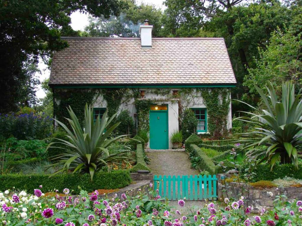 This house has a lush garden setting with trees that will increase property value.