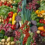 An incredible vegetable display tomatoes, potatoes, leeks, peppers, onions, lettuce and so on