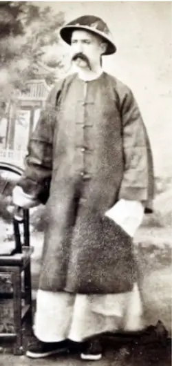 Man in traditional Chinese attire with hat