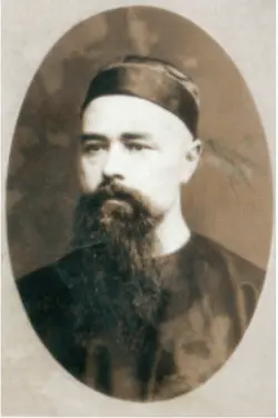 Sepia portrait of bearded man in cap